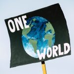 Sign that reads "One World"